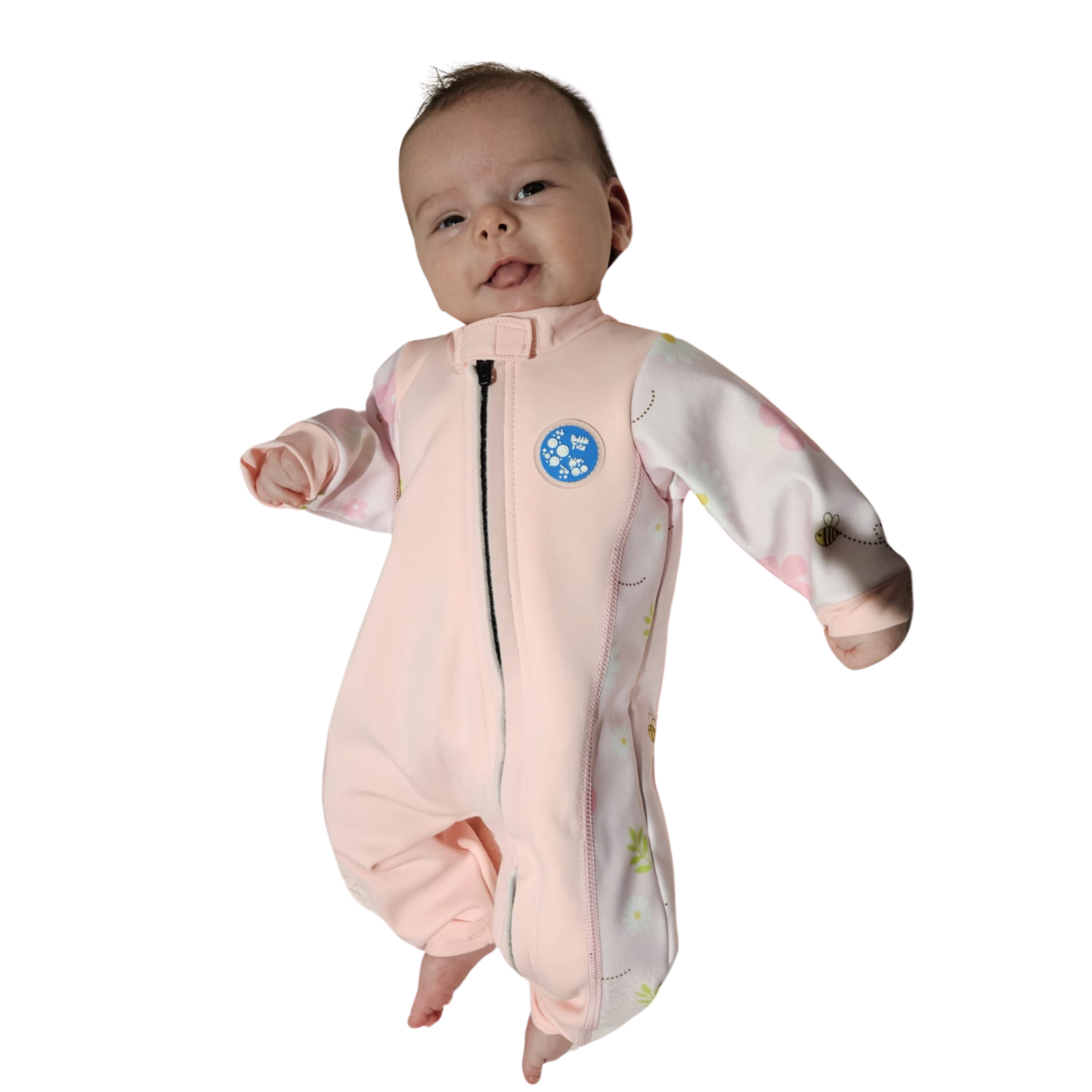 Bubble Tots Easy Zip Thermal Swim Suit Pink Flowers and Bees Spring Design An image of the Bubble Tots Easy Zip Thermal Swimsuit in Pink Flowers and Bees Spring design. The design features playful Bees and Flowers. The background colour is a soothing neutral pink tone with pops of vibrant Flowers and Bees illustrations
