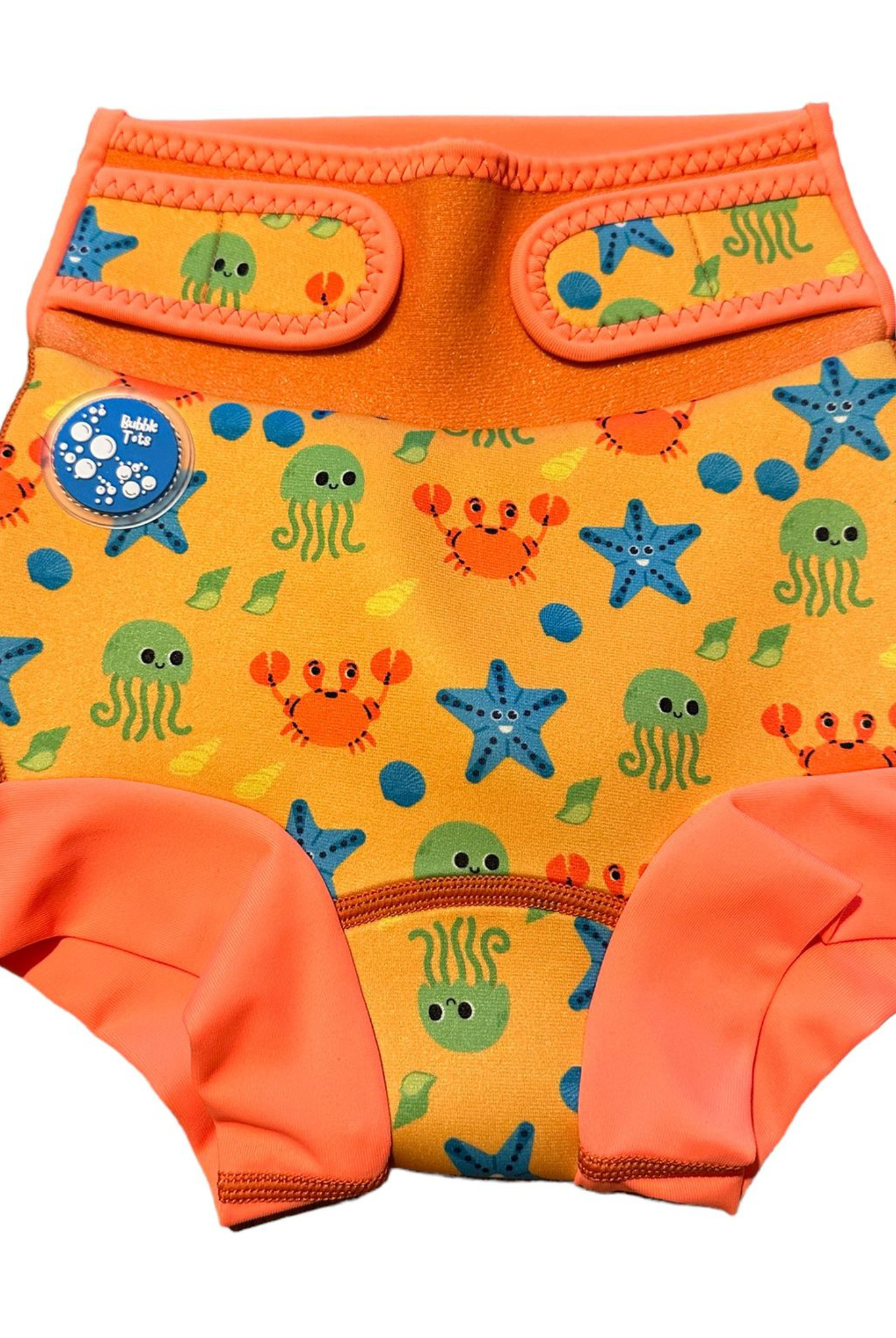 Bubble Tots Go Anywhere Swim Nappy Blue Dinosaurs Design An image of the Bubble Tots Go Anywhere Swim Nappy in Blue Dinosaurs design. The design features playful Dinosaurs, Eggs and Prints.