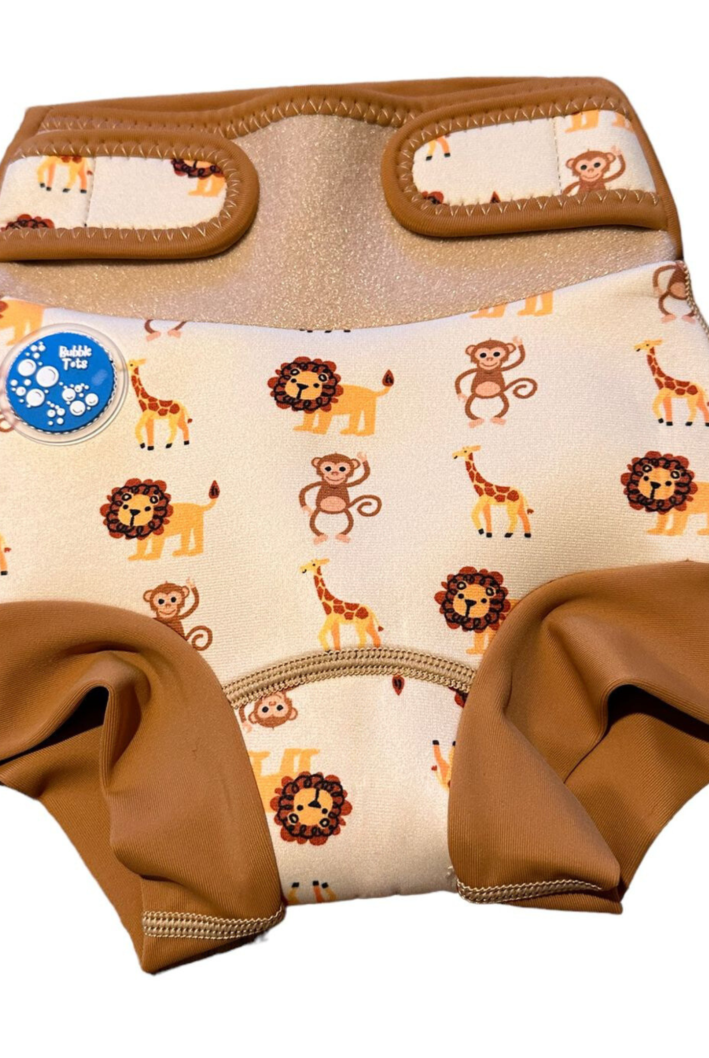 Bubble Tots Go Anywhere Swim Nappy Safari Animals Design An image of the Bubble Tots Go Anywhere Swim Nappy in Yellow Beige Safari Animals design. The design features playful Monkeys, Giraffes and Lions.