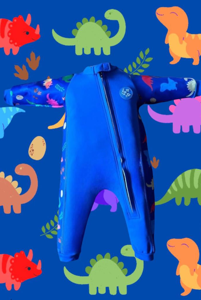 An image of the Bubble Tots Easy Zip Thermal Swimsuit in Blue Dinosaur design. The design features playful Dinosaurs and Eggs. The background colour is a bright vibrant tone with pops of vibrant Dinosaur illustrations