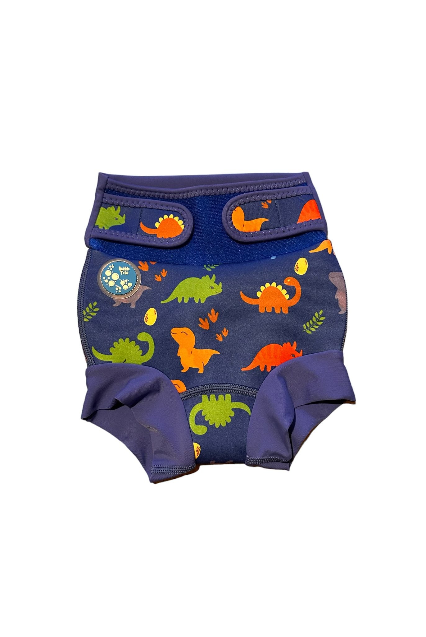 Bubble Tots Go Anywhere Swim Nappy Blue Dinosaurs Design An image of the Bubble Tots Go Anywhere Swim Nappy in Blue Dinosaurs design. The design features playful Dinosaurs, Eggs and Prints.