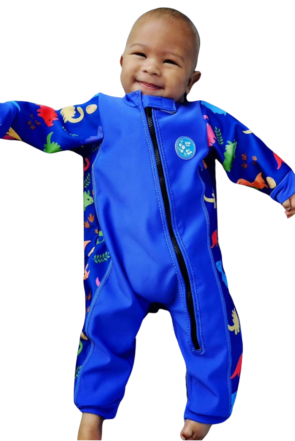 An image of the Bubble Tots Easy Zip Thermal Swimsuit in Blue Dinosaur design. The design features playful Dinosaurs and Eggs. The background colour is a bright vibrant tone with pops of vibrant Dinosaur illustrations