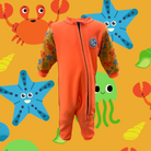 An image of the Bubble Tots Easy Zip Thermal Swimsuit in Orange Under the Sea design. The design features playful Starfish, Jellyfish. Crabs and Shells. The background colour is a bright vibrant orange tone with pops of vibrant sea creature illustrations