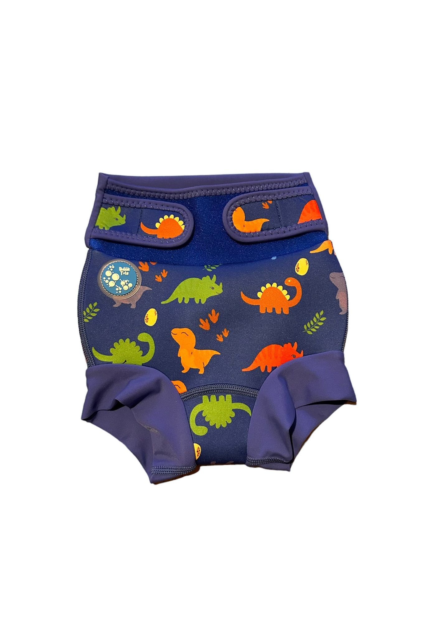 Bubble Tots Go Anywhere Swim Nappy Blue Dinosaurs Design An image of the Bubble Tots Go Anywhere Swim Nappy in Blue Dinosaurs design. The design features playful Dinosaurs, Eggs and Prints. 